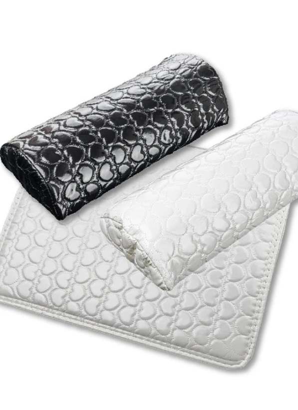 Manicure hand rest with artificial leather surfaceThe comfortable hand rest with mat provides added comfort for the client during manicure treatments. The mat can also be used as a background for nail and manicure photography. If necessary, the artificial leather surface should be gently cleaned with a paper towel and a suitable surface cleaner. To avoid damaging the material, the use of aggressive disinfectants is not recommended.Dimensions: Hand rest: 31 cm x 13 cm, height – 6 cm. Mat: 38 cm x...